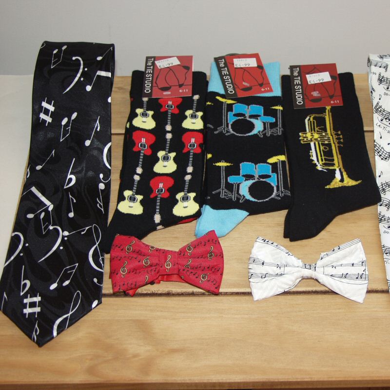Socks, scarves, ties and bow ties featuring musical instruments and music themes.